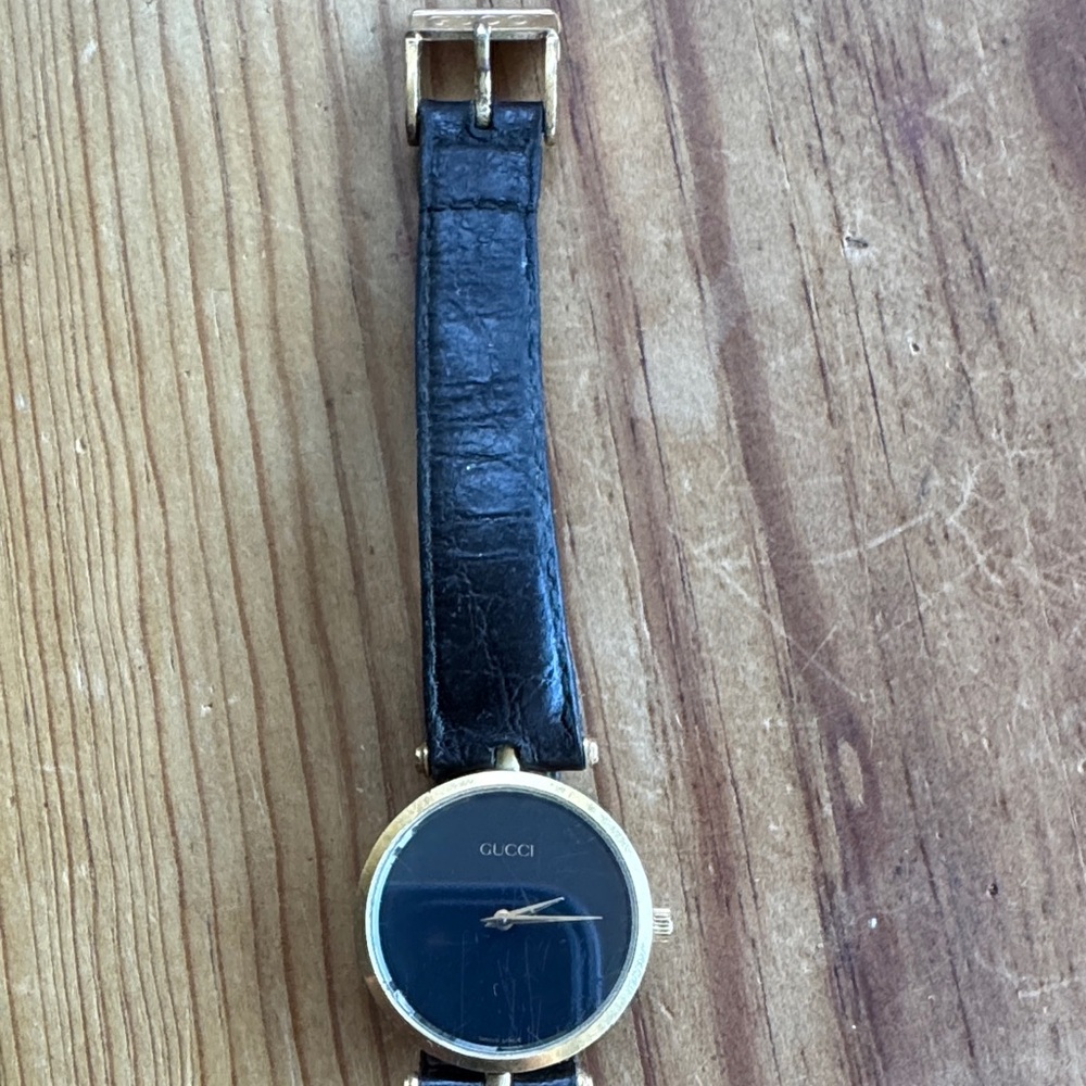 Gucci Men's Watch with Black Strap and Gold Accents